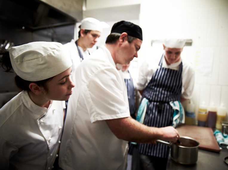 Greg Hampton teaching students